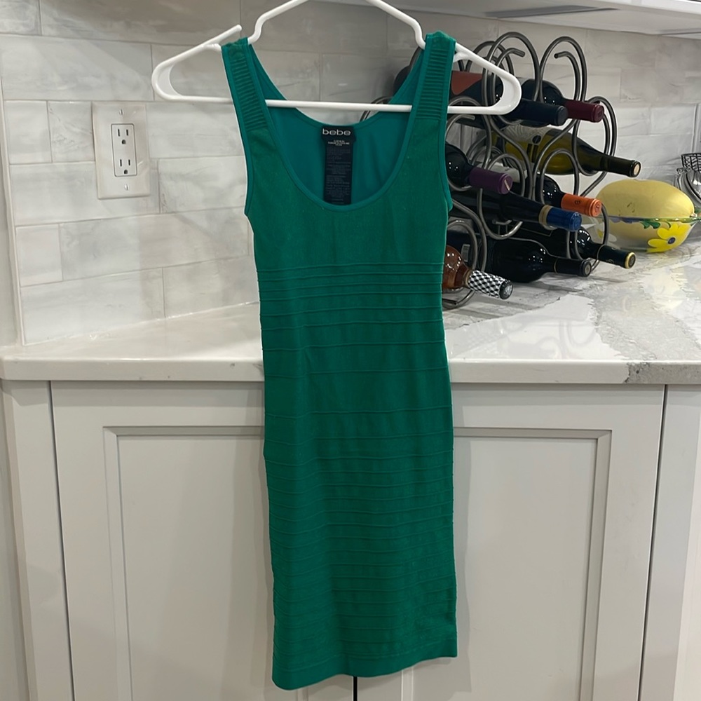 Emerald green Bebe dress size small. Cut out in the back